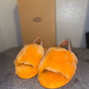 Toddler girl slippers in color orange size 11.